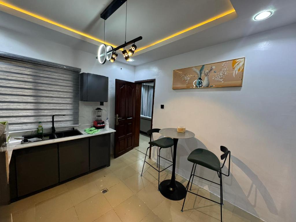 Kuchyň nebo kuchyňský kout v ubytování Cozy Ambience 1