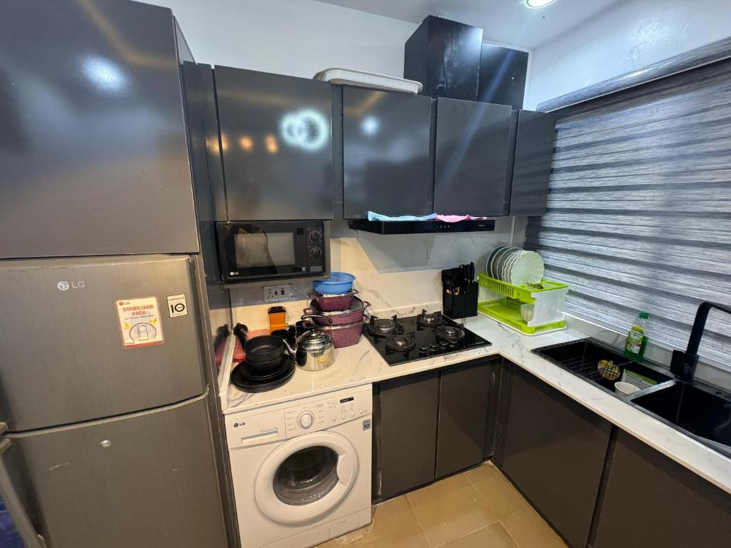 Kuchyň nebo kuchyňský kout v ubytování Cozy Ambience 1