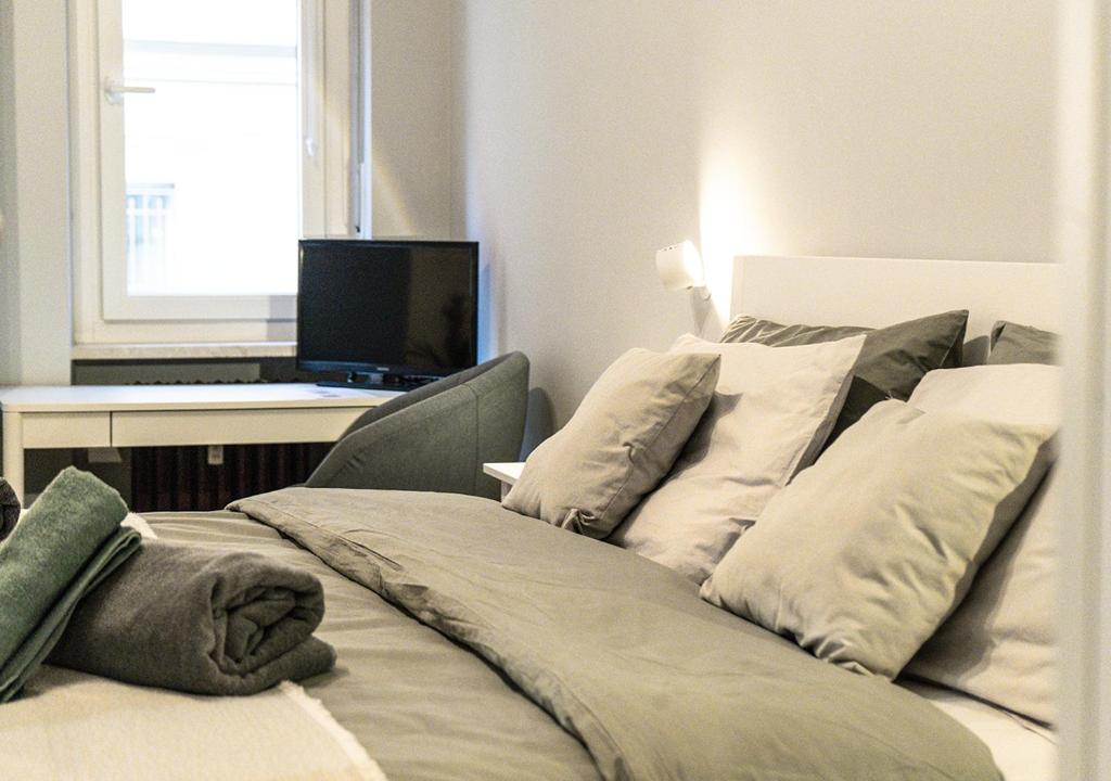 Postel nebo postele na pokoji v ubytování Vittoria House Turin I - Appartamento al Valentino centro Torino