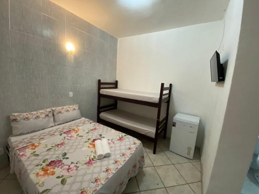 Postel nebo postele na pokoji v ubytování Pousada 3 Irmãos