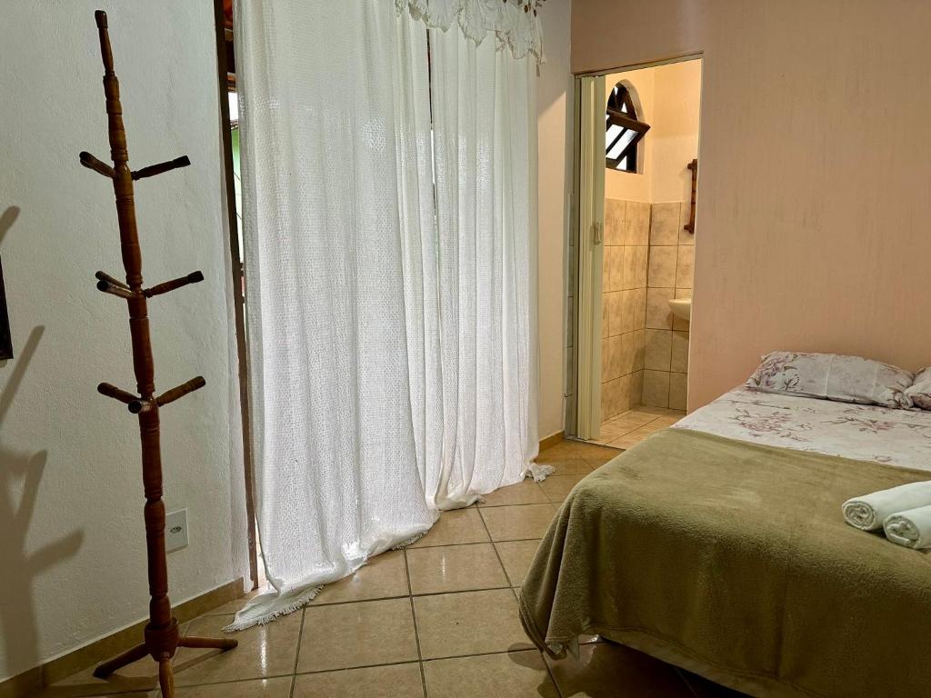 Postel nebo postele na pokoji v ubytování Pousada 3 Irmãos
