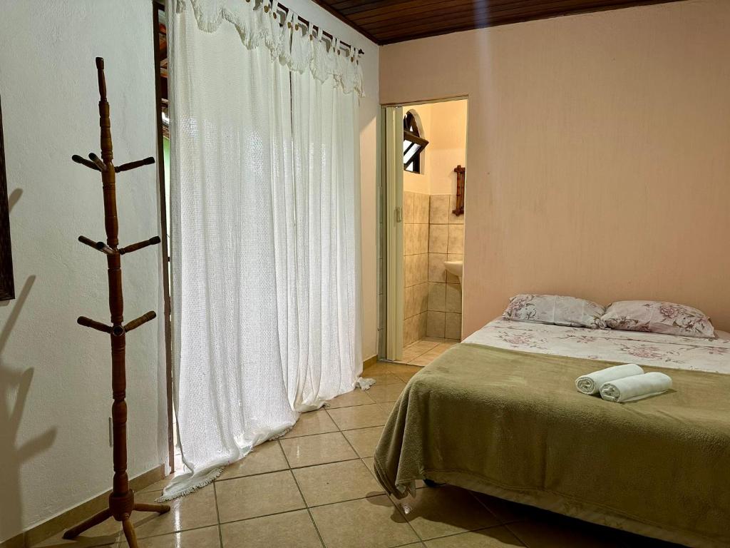 Postel nebo postele na pokoji v ubytování Pousada 3 Irmãos