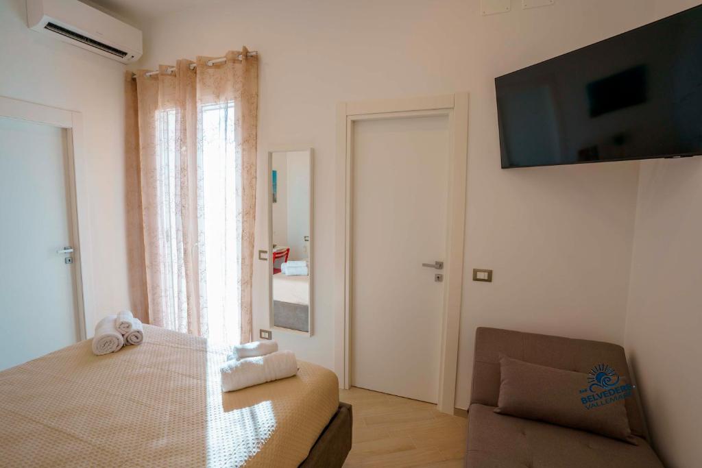 Postel nebo postele na pokoji v ubytování Belvedere Valle Mare
