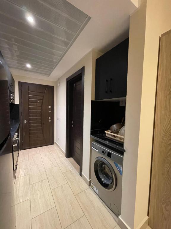 A television and/or entertainment centre at AlDau Heights Apartments