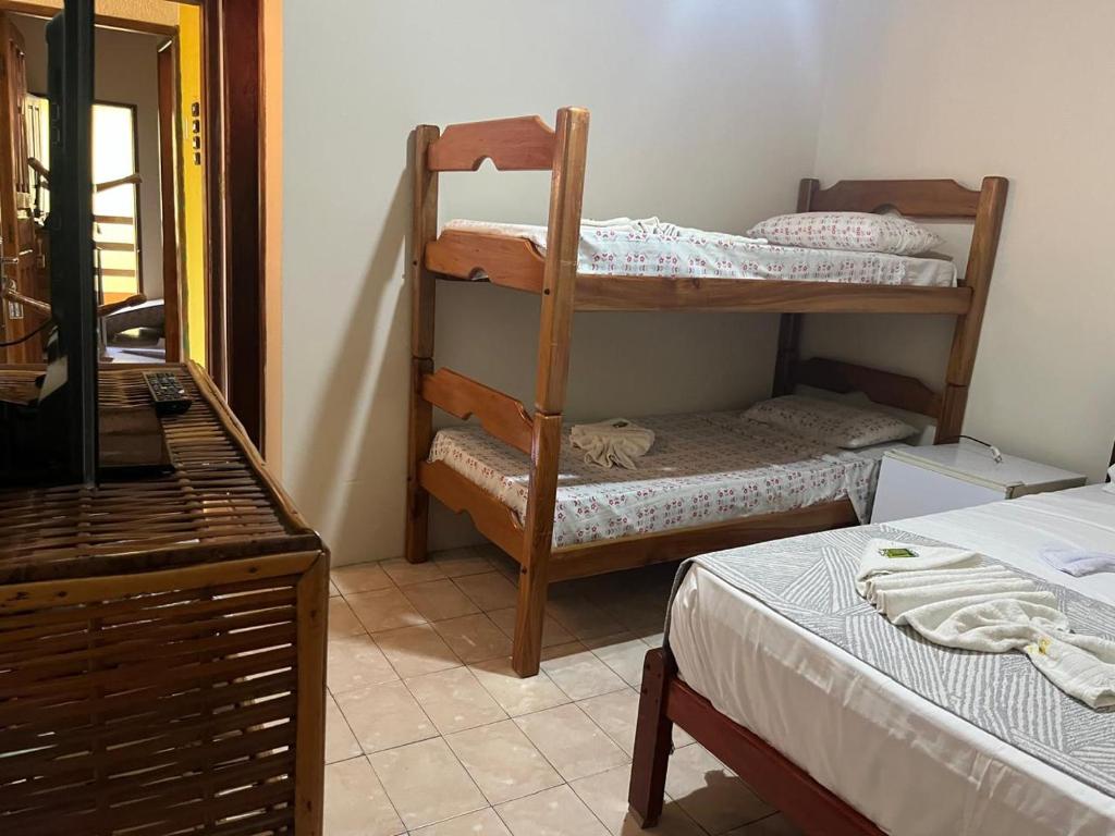 Postel nebo postele na pokoji v ubytování Pousada Passarela da Pituba