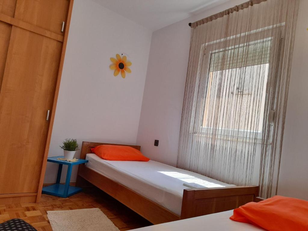 Łóżko lub łóżka w pokoju w obiekcie Apartments Clair