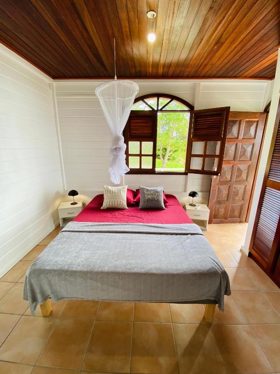 Letto o letti in una camera di Villa Créole vue exceptionnelle Perle des Hauteurs
