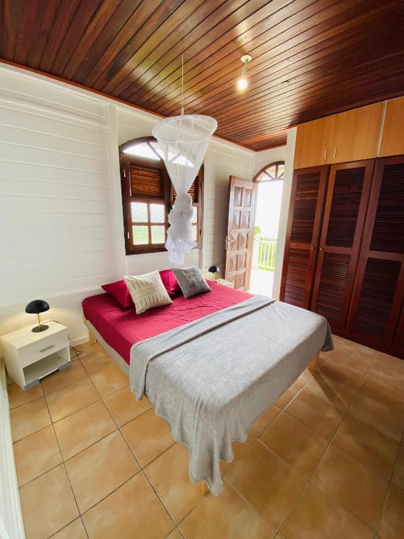 Letto o letti in una camera di Villa Créole vue exceptionnelle Perle des Hauteurs