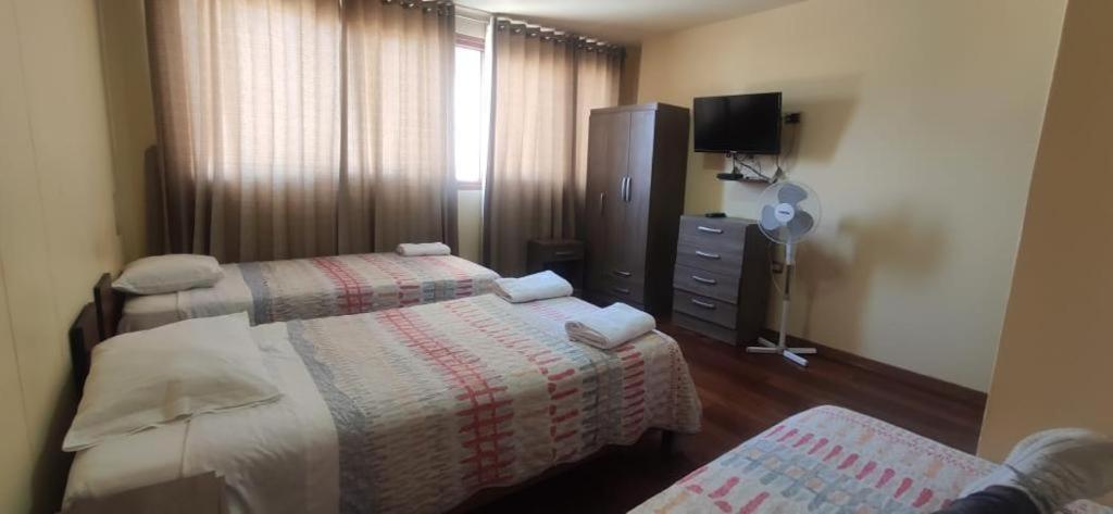 Postel nebo postele na pokoji v ubytování Casa Huéspedes Pimentel