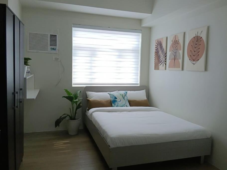 Llit o llits en una habitació de Vista GL Taft Studio Unit