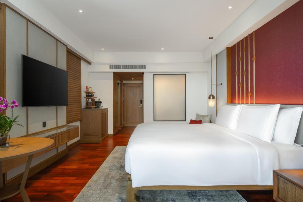 Postel nebo postele na pokoji v ubytování Anantara Hua Hin Resort