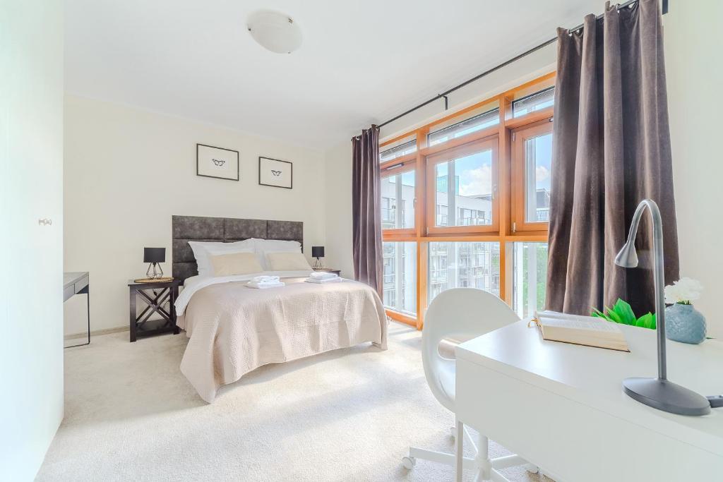 Posteľ alebo postele v izbe v ubytovaní Zygmunta Slominskiego 5 - P&O Apartments