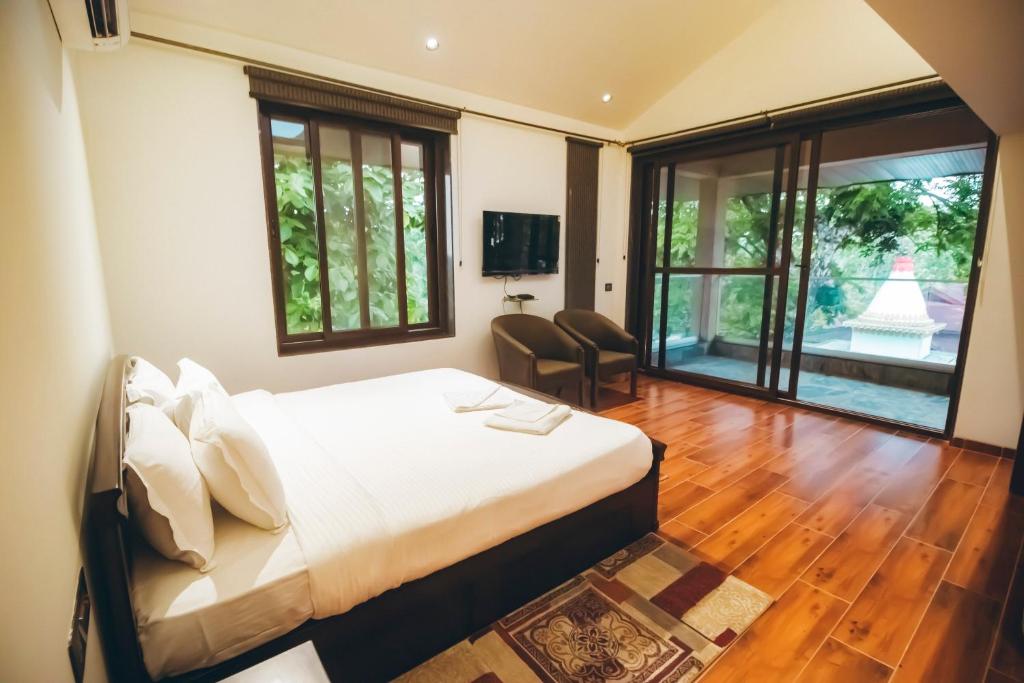Ένα ή περισσότερα κρεβάτια σε δωμάτιο στο Red River Bungalow