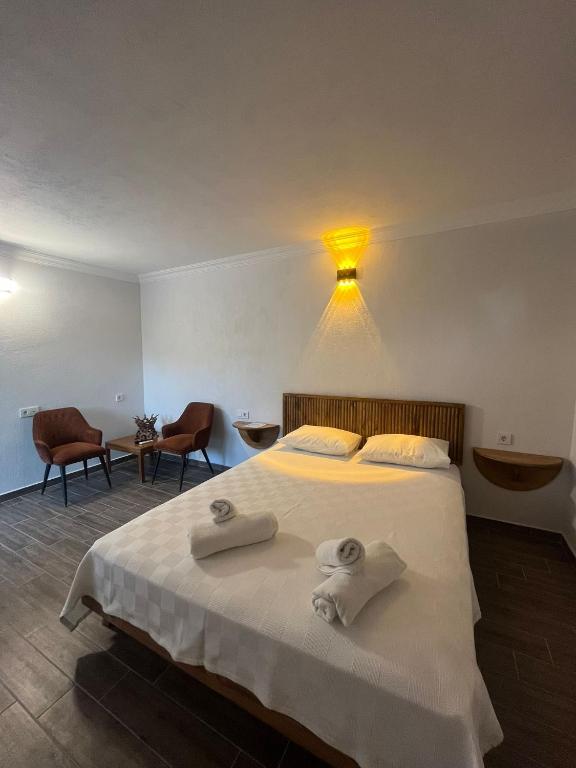Postel nebo postele na pokoji v ubytování İlçayto Suites