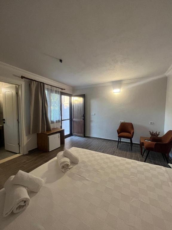 Postel nebo postele na pokoji v ubytování İlçayto Suites