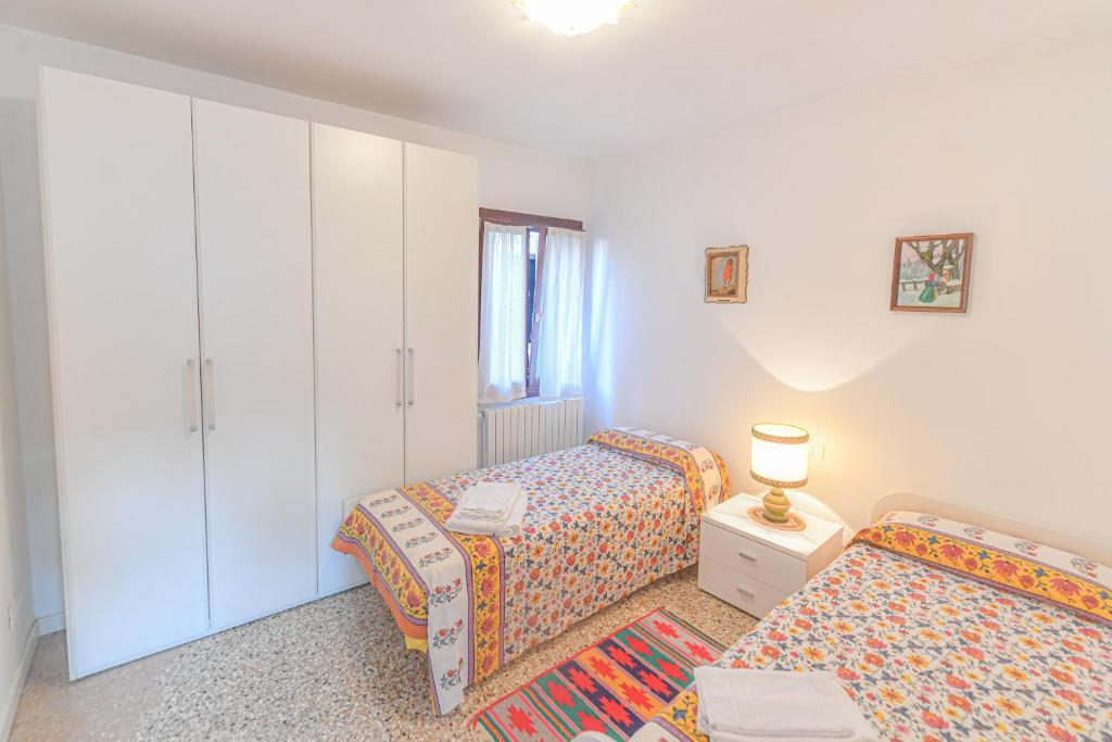 A bed or beds in a room at Ca' Botera