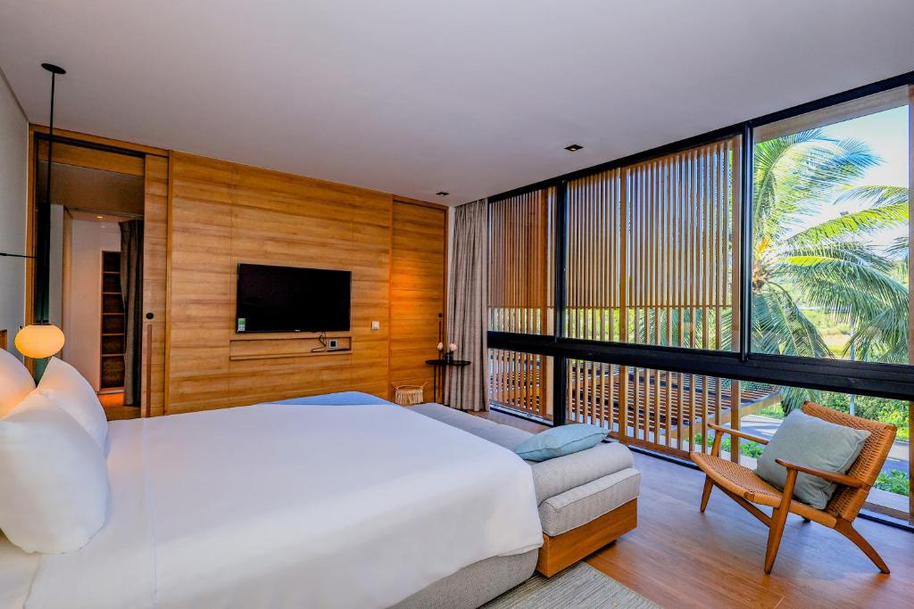 Postel nebo postele na pokoji v ubytování Sailing Luxury Phu Quoc Villas