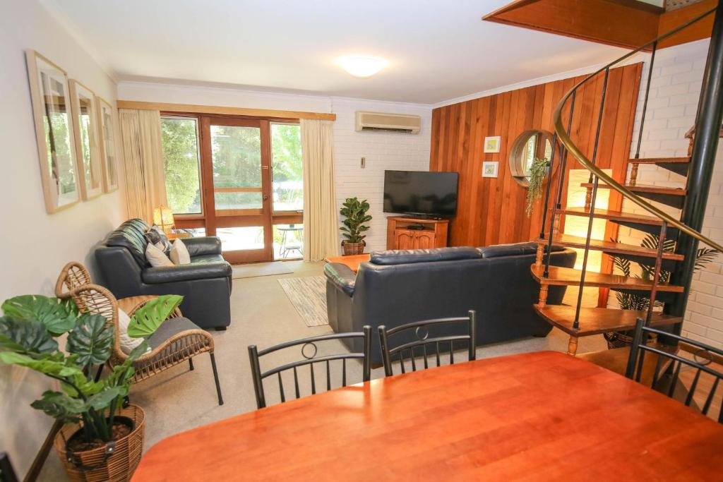 a living room with a couch and a table at Cedar Holiday Units - Apartment 3 in Bright