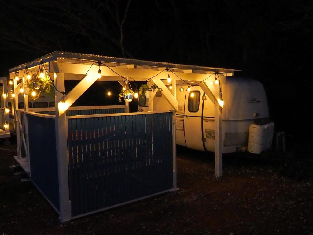 a white trailer with lights on it in the dark at NAT PARK - Camp - Vacation STAY 42069v in Iwada