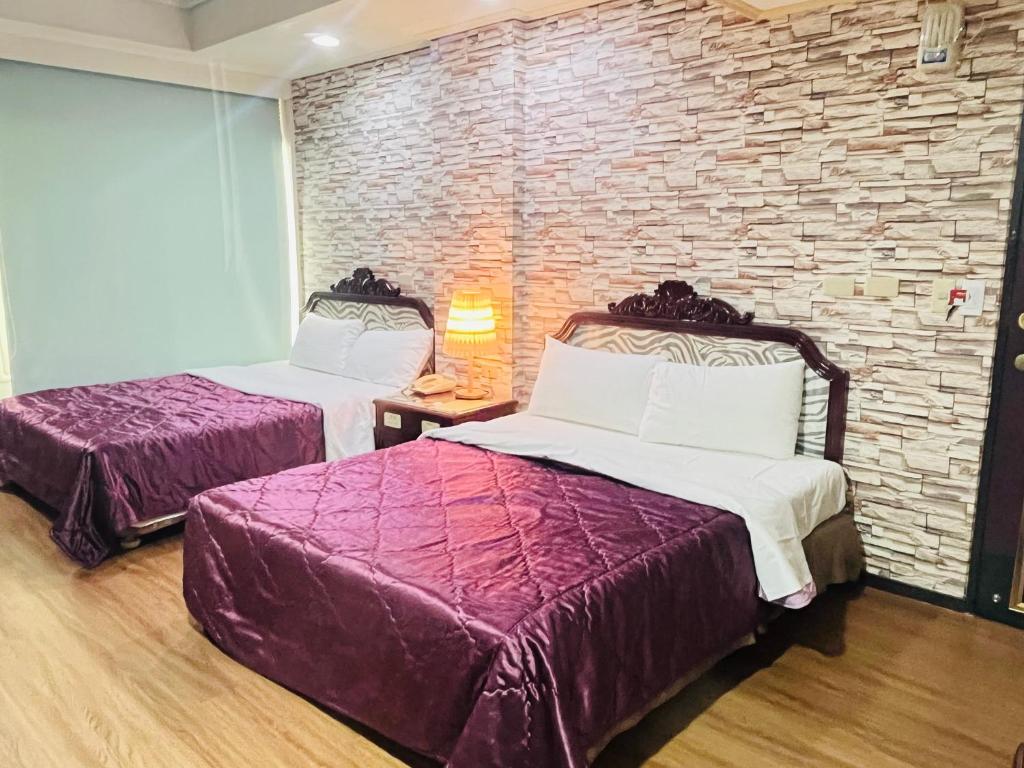Voodi või voodid majutusasutuse Garden Business Hotel toas