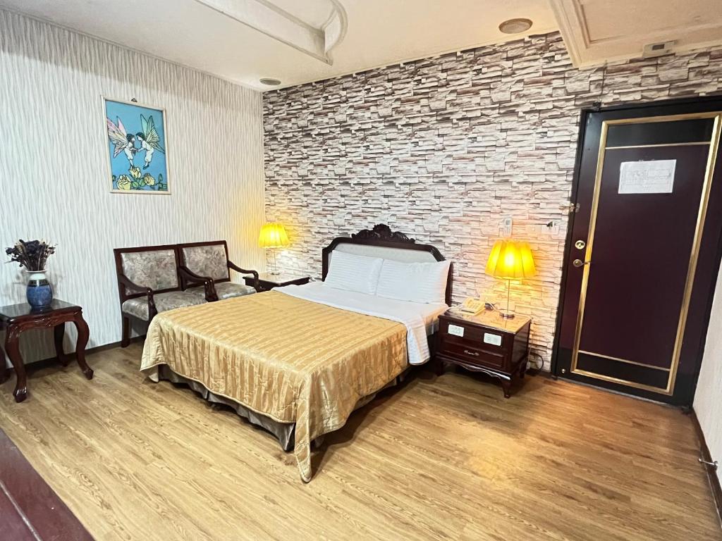 Voodi või voodid majutusasutuse Garden Business Hotel toas