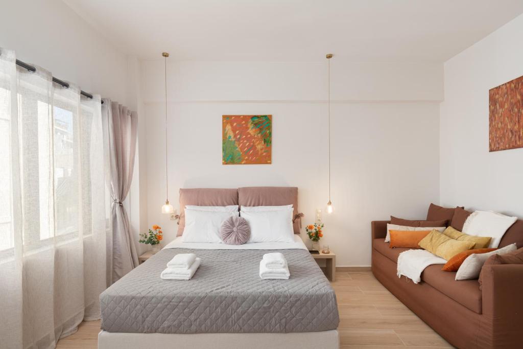 a bedroom with a bed and a couch at M18 Studios Monastiraki Gems in Athens