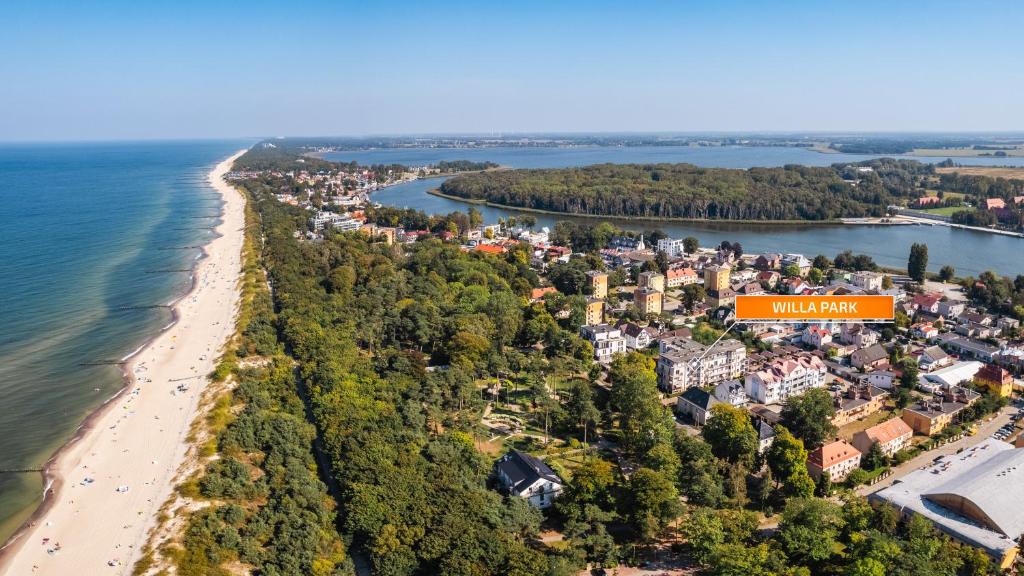 an aerial view of a town next to a beach at Willa Park, Sun & Snow in Dziwnów