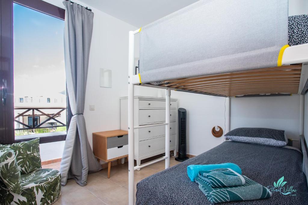 Postel nebo postele na pokoji v ubytování Villa Oliral