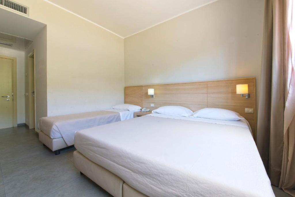 Postel nebo postele na pokoji v ubytování FerroHotel