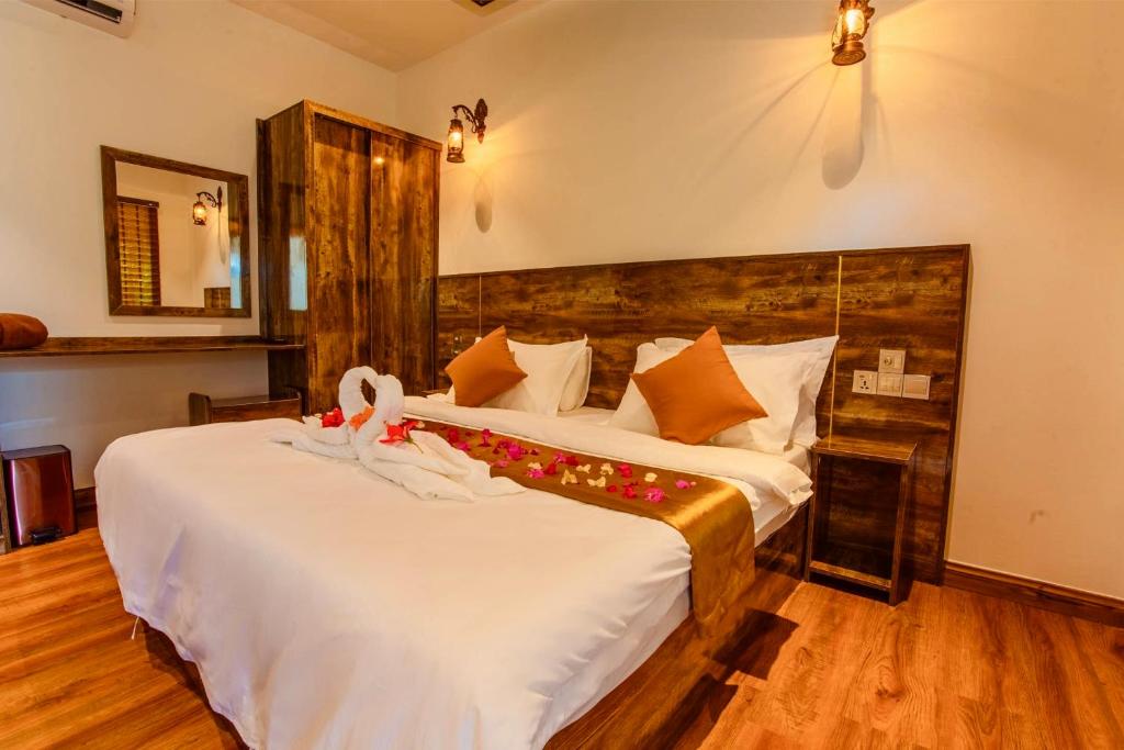 Postel nebo postele na pokoji v ubytování Rustic Villa