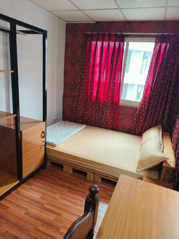 Postel nebo postele na pokoji v ubytování Peakman Residence