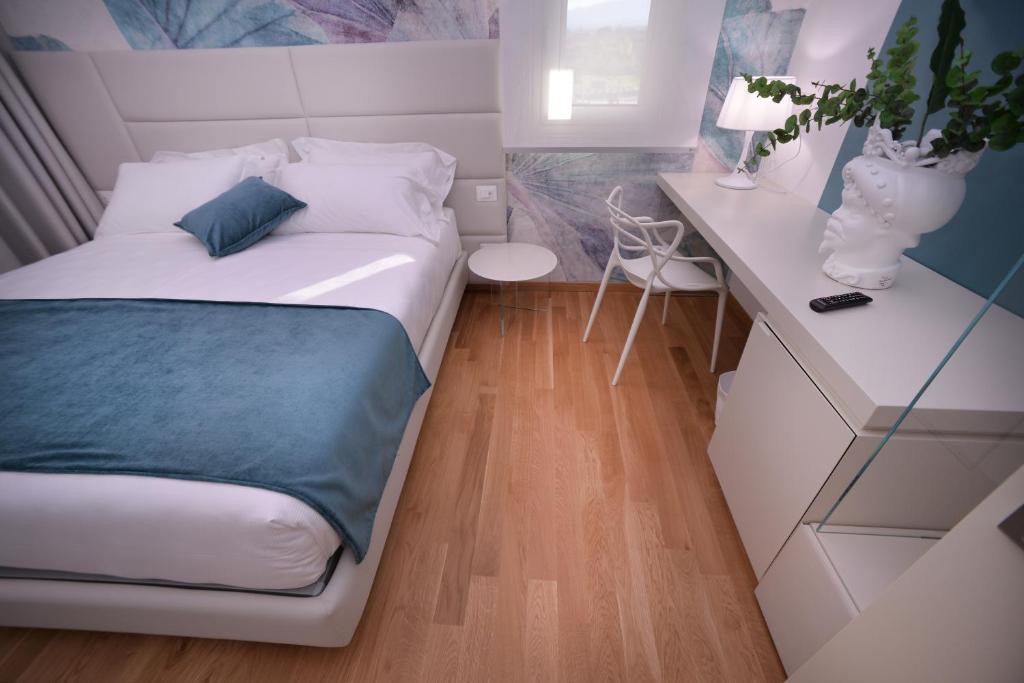 Postel nebo postele na pokoji v ubytování Santantonioresort