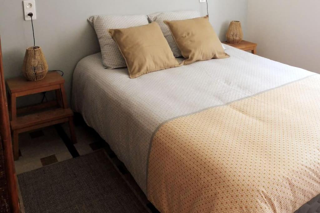 En eller flere senge i et værelse på A Carolles, maison idéale pour des vacances Nature