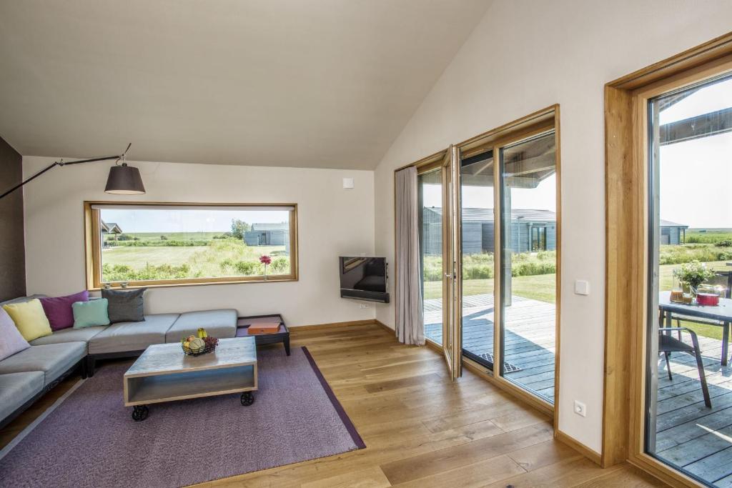 Posezení v ubytování Gud Jard Lodge Nr 10 - Design-Ferienhaus mit exklusiver Ausstattung