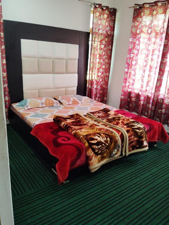 Postel nebo postele na pokoji v ubytování Moonlight Homestay