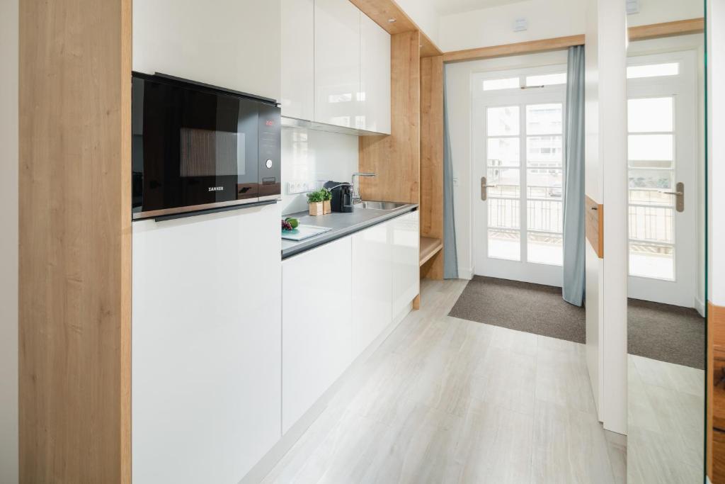 Kuchyň nebo kuchyňský kout v ubytování Nordstrandperlen Apartments