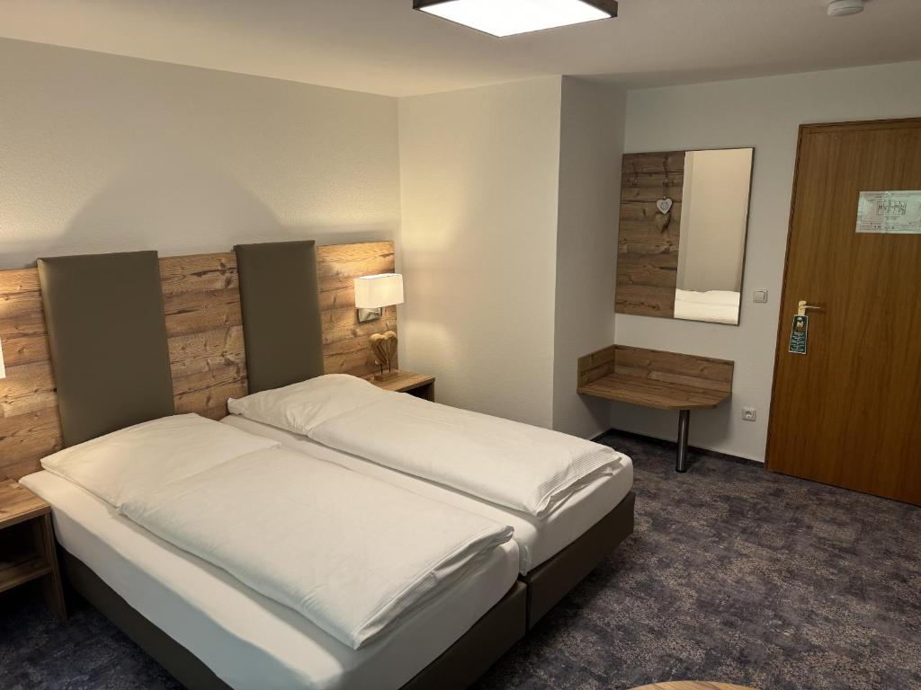 Postel nebo postele na pokoji v ubytování Hotel Silberfelsen