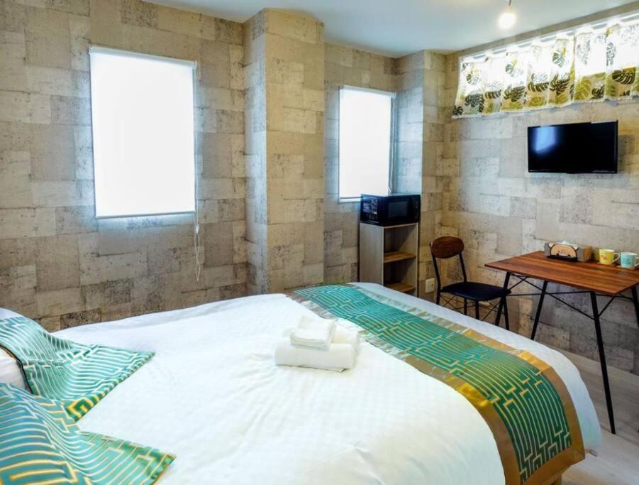 Ένα ή περισσότερα κρεβάτια σε δωμάτιο στο F HOUSE Os Residence D5