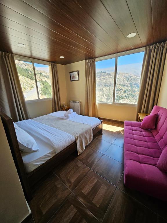 Postel nebo postele na pokoji v ubytování Hotel L'Aiglon