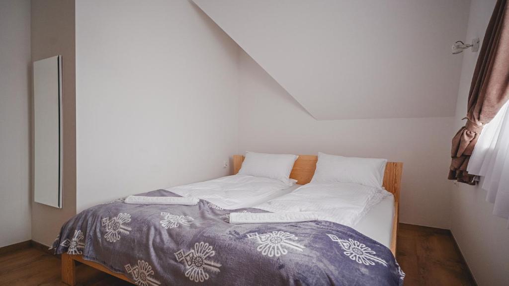Postel nebo postele na pokoji v ubytování Apartamenty Sun & Snow Kaniówka