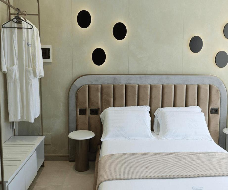 a bedroom with a large bed and a table at Comfort Suites in Golem