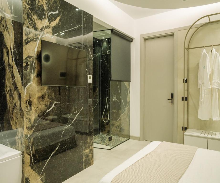 a bathroom with a shower and a sink at Comfort Suites in Golem