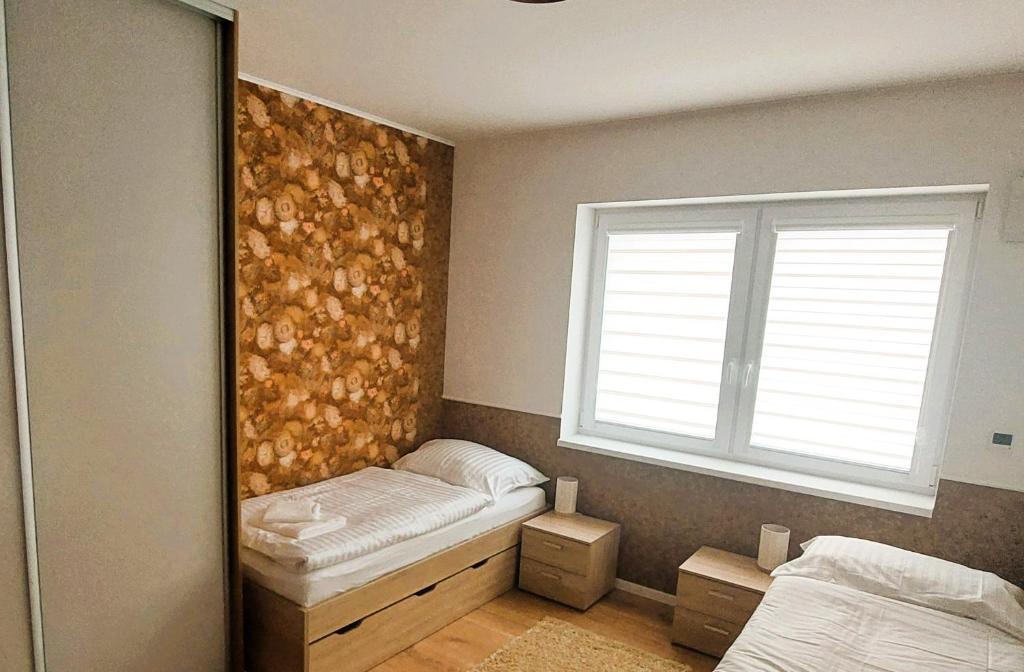 Postel nebo postele na pokoji v ubytování Three Diamonds Residence