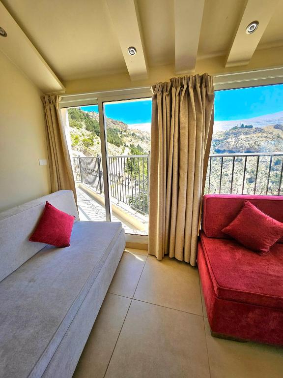 Postel nebo postele na pokoji v ubytování Hotel L'Aiglon