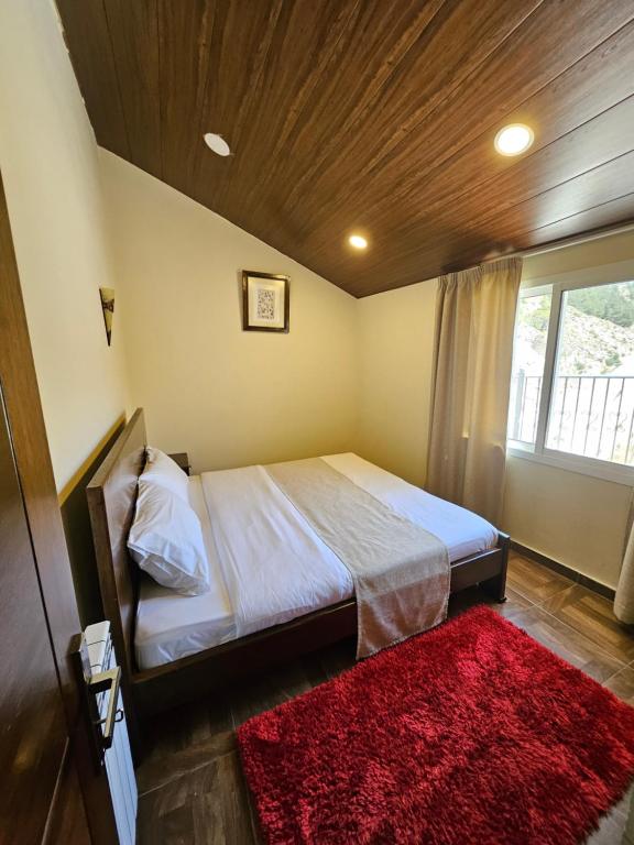 Postel nebo postele na pokoji v ubytování Hotel L'Aiglon