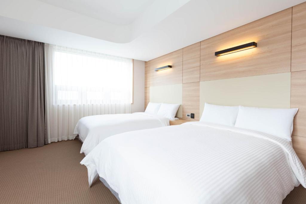 Postel nebo postele na pokoji v ubytování Acube Hotel Dongdaemun