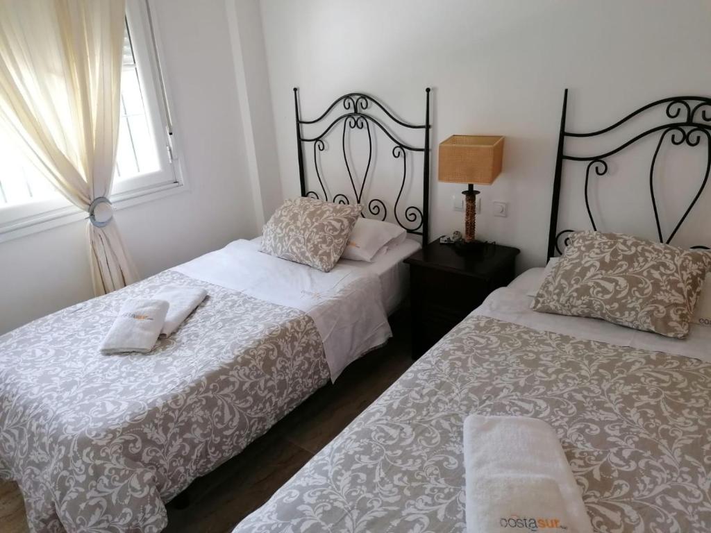 Postel nebo postele na pokoji v ubytování Apartamento Castillo de Mar