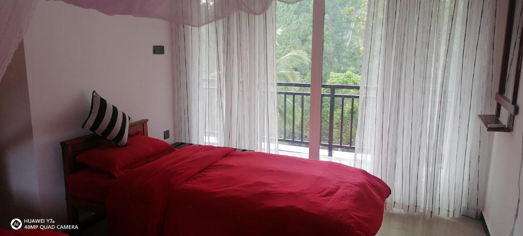Postel nebo postele na pokoji v ubytování Isuru Homestay