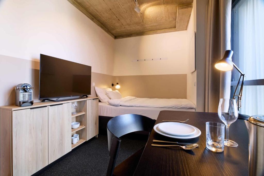 TV a/nebo společenská místnost v ubytování District Living