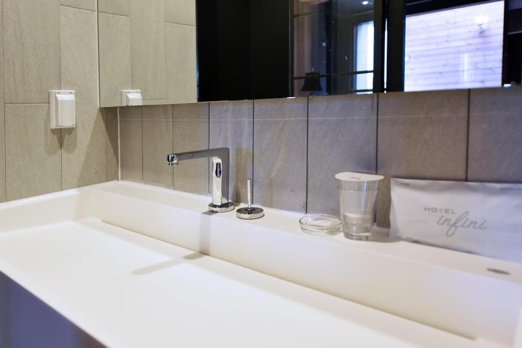 Koupelna v ubytování Hotel Infini